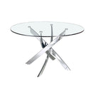Mesa comedor redonda de cristal templado con patas de acero en aspa acabado cromado, sobre fondo gris de estudio