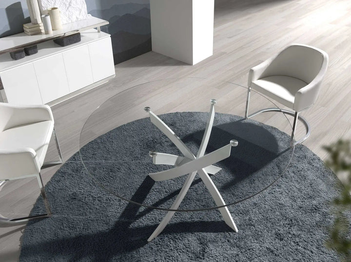 Mesa comedor redonda cristal templado y acero blanco en ambiente decorado