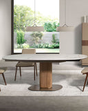 Mesa comedor extensible ovalada barril mármol porcelánico y nogal