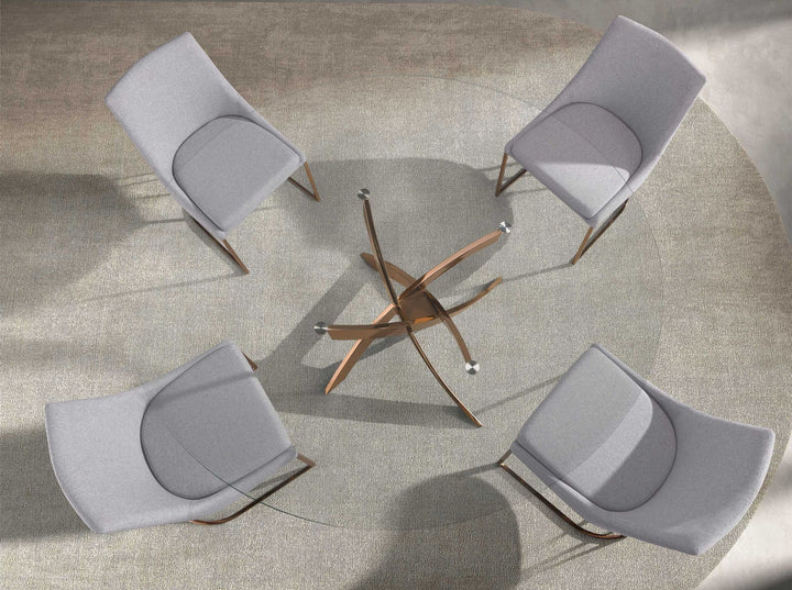 Mesa comedor redonda cristal templado y acero rosa en ambiente decorado (2)