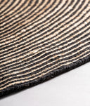 ALFOMBRA LEANDRA DE ALGODÓN BEIGE CON DETALLES NEGROS REDONDA