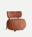 Sillón tapizado en bouclé terracota