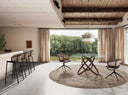 Brown rattan and velvet swivel chair