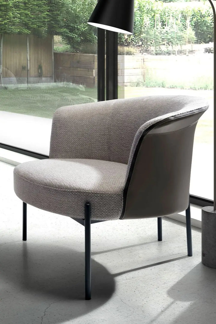 Grey fabric and dark grey leatherette armchair