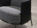 sillón tela blanca y negra y polipiel negro