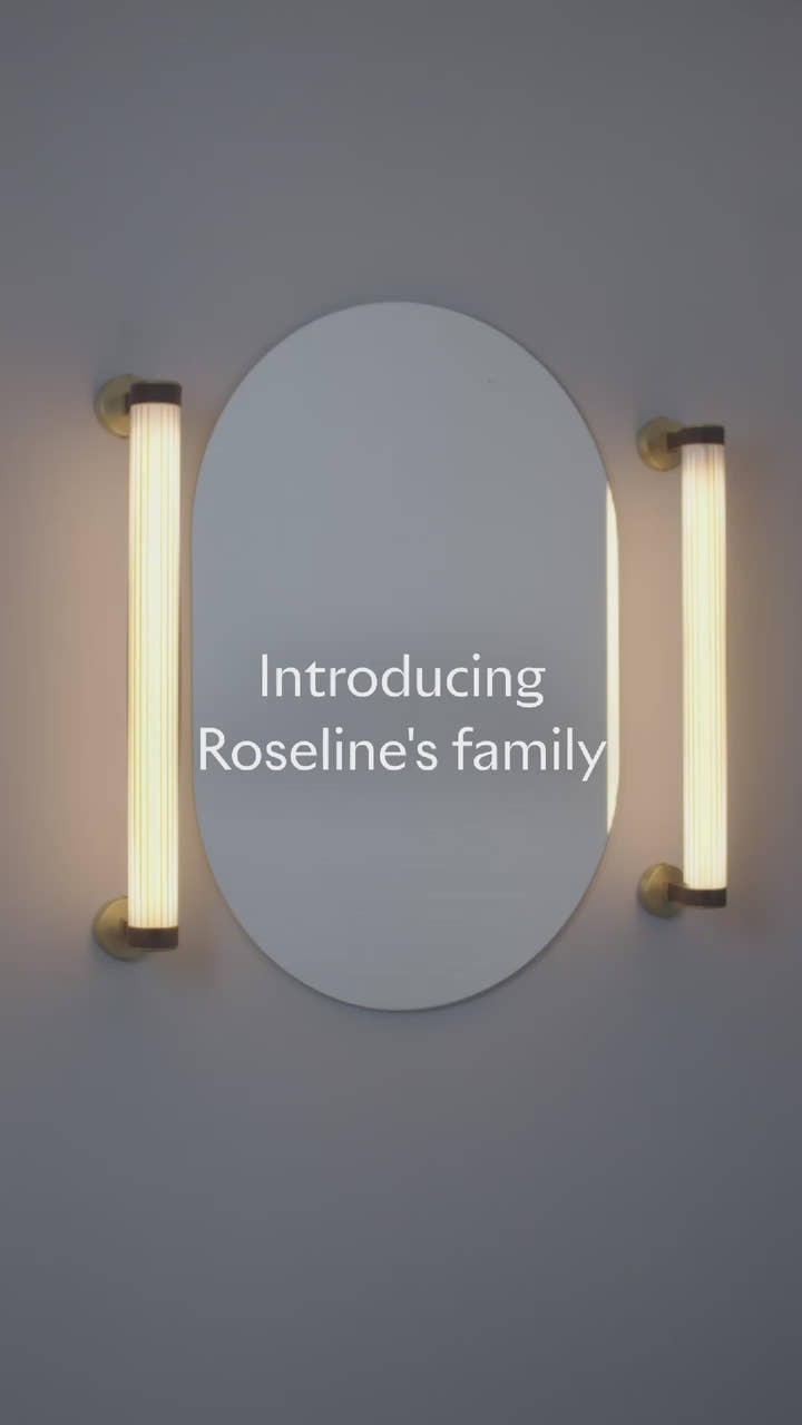 Roseline Wall Lamp 56 - Black base, beige strap and transparent glass shade.