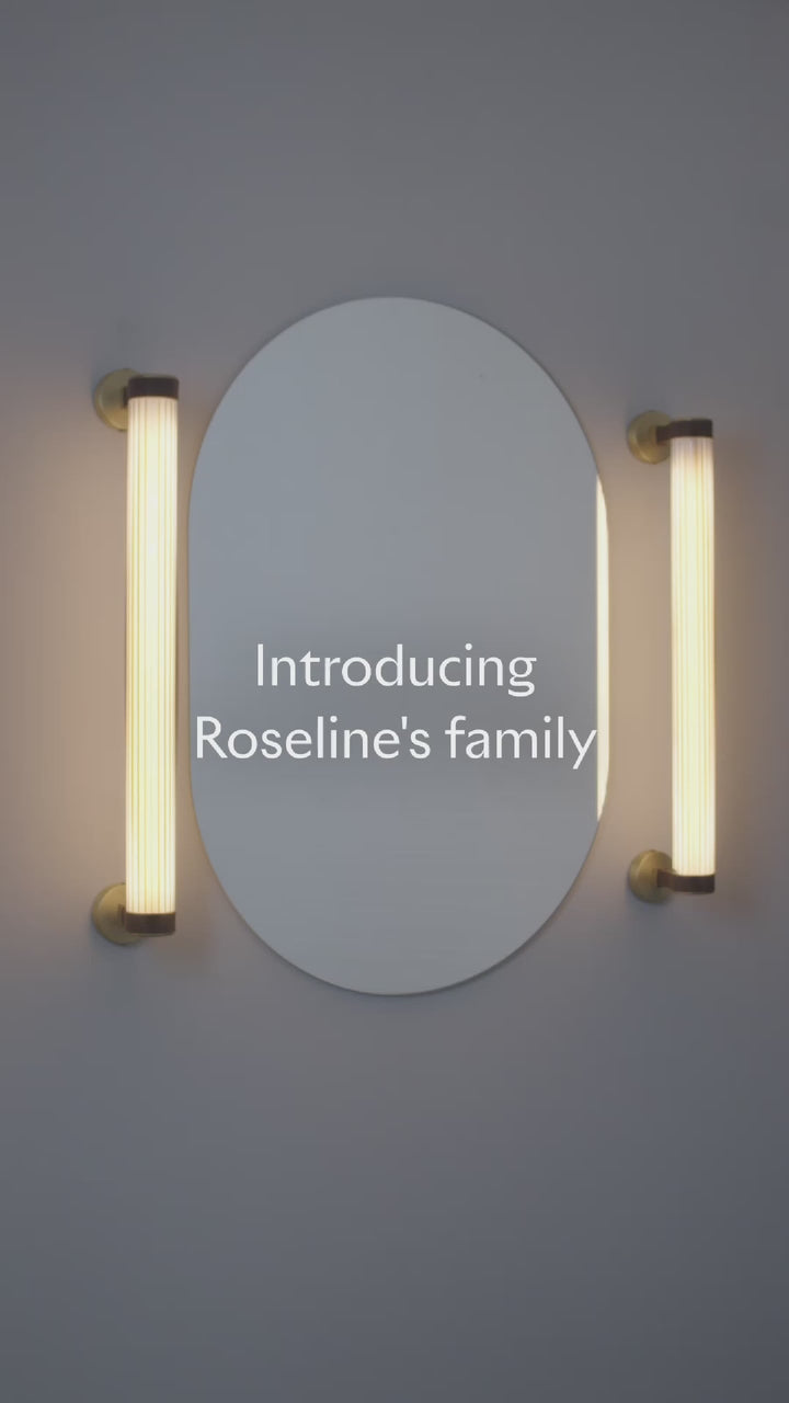 Roseline Wall Lamp 56 - Black base, beige strap and transparent glass shade.