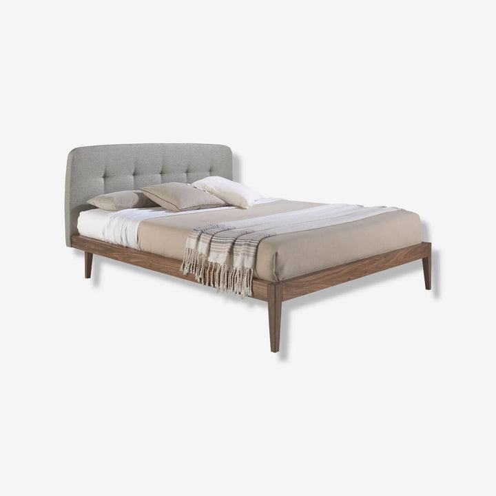 Tufted bed in grey fabric