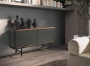 Comoda de diseno moderno con estructura de madera de MDF color gris oscuro en acabado mate y unas originales patas de acero inoxidable color negro.