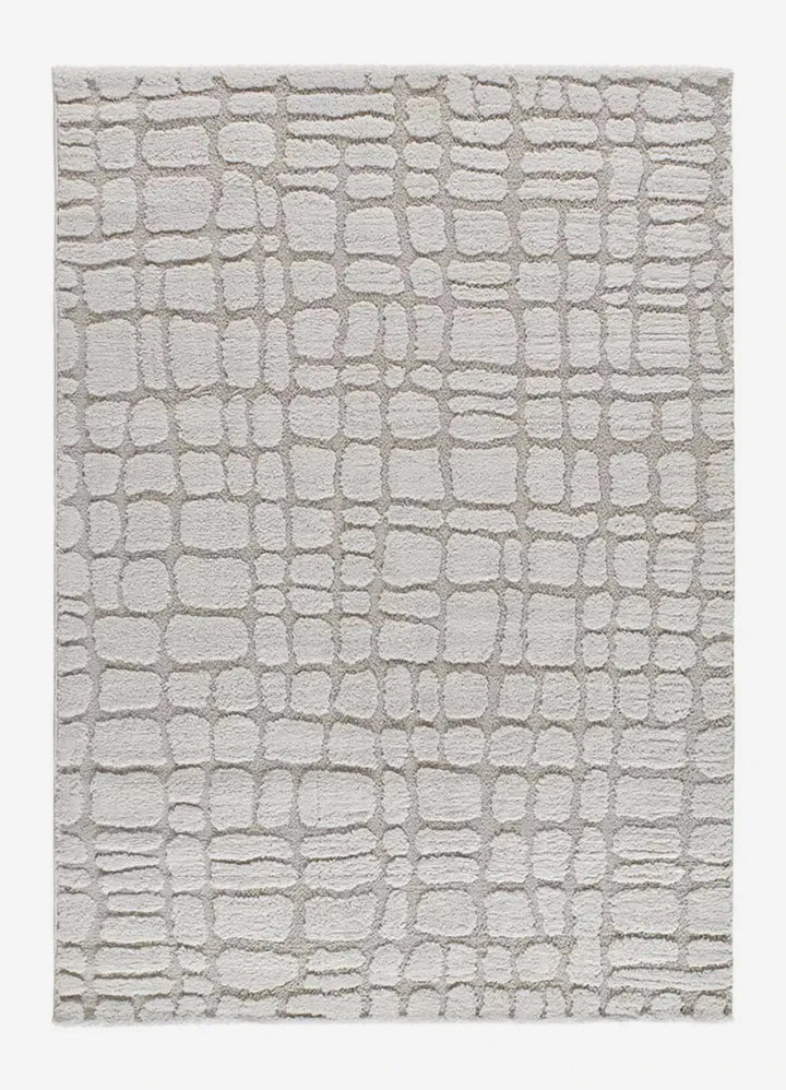 ALFOMBRA JUNO 13 DE ESTILO ESCANDINAVO CON RELIEVE EN COLOR PIEDRA, foto de producto sobre fondo gris de estudio