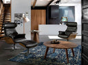 butaca de piel negra con mecanismo reclinable y base giratoria, respaldo alto con soporte lumbar