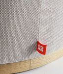Repose-pieds RUREY rond en tissu avec socle en bois massif