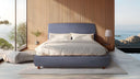 Cama tapizada con cabecero de esquinas redondeadas y base de muelles ensacados de 16 cm – ambiente