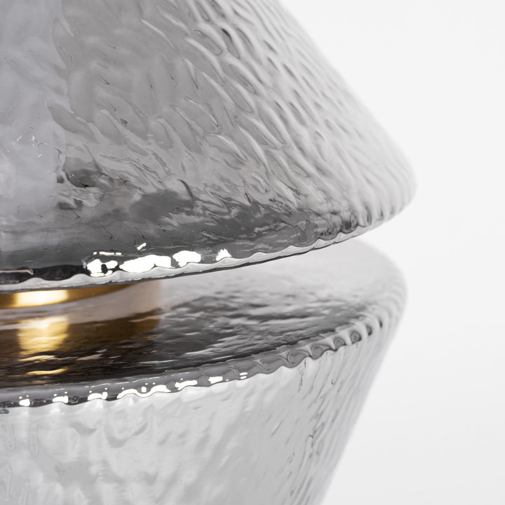 Lámpara de mesa de cristal y hierro en color gris – detalle