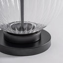 Lámpara de mesa de vidrio y hierro transparente – detalle