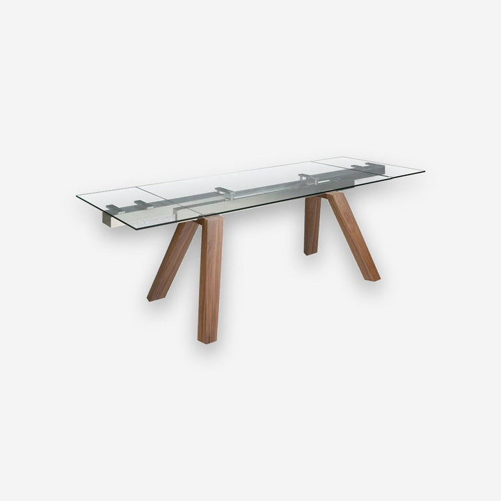 Mesa comedor extensible rectangular cristal templado y nogal sobre fondo gris de estudio