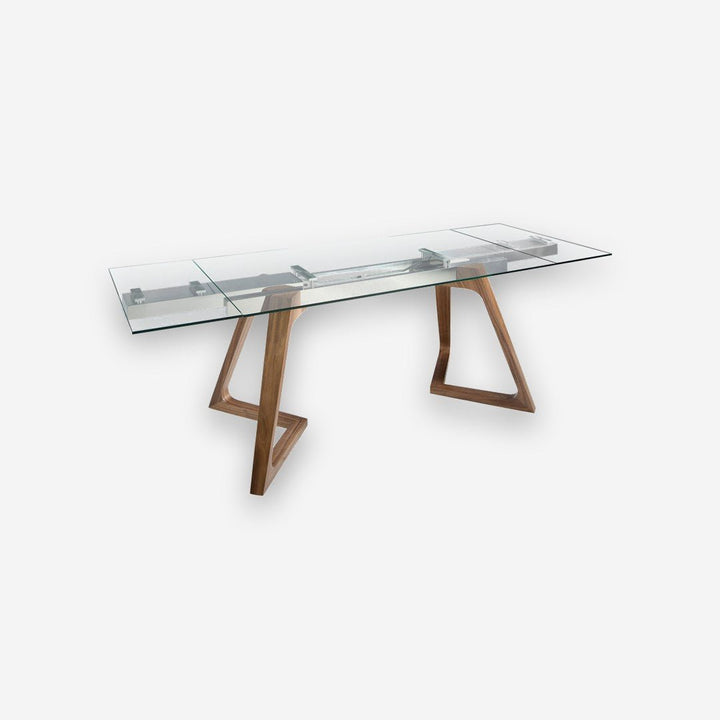 Mesa comedor extensible rectangular cristal templado y nogal sobre fondo gris de estudio