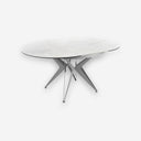Mesa comedor extensible redonda mármol porcelánico y acero gris sobre fondo gris de estudio