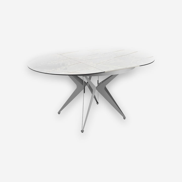 Mesa comedor extensible redonda mármol porcelánico y acero gris sobre fondo gris de estudio