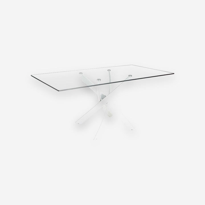 Mesa comedor rectangular de cristal templado con patas de acero en aspa acabado blanco, sobre fondo gris de estudio