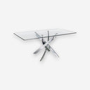 Mesa comedor rectangular cristal templado y acero cromado sobre fondo gris de estudio