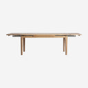 Mesa de comedor extensible de madera de fresno en color marrón claro 180 x 90 x 78 cm
