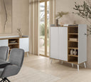 Mueble auxiliar de laminado blanco y patas de madera en ambiente decorado