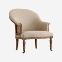 Sillón de madera de fresno y loneta en color arena envejecido