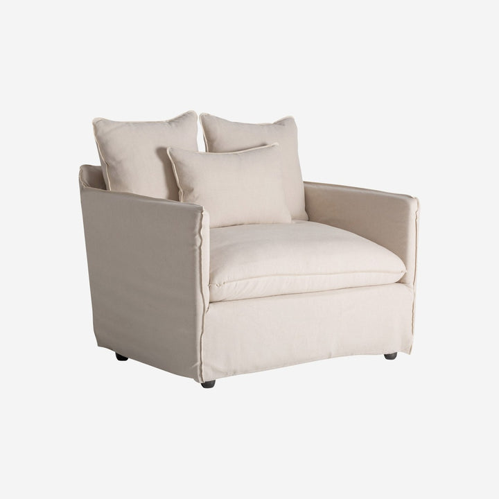 Sillón tapizado en lino en color beige