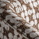 Sillón tapizado en poliéster en color ocre – detalle