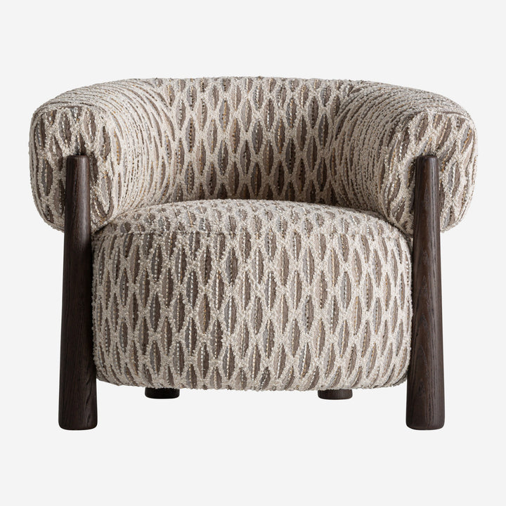 Sillón tapizado en poliéster en tonos neutros