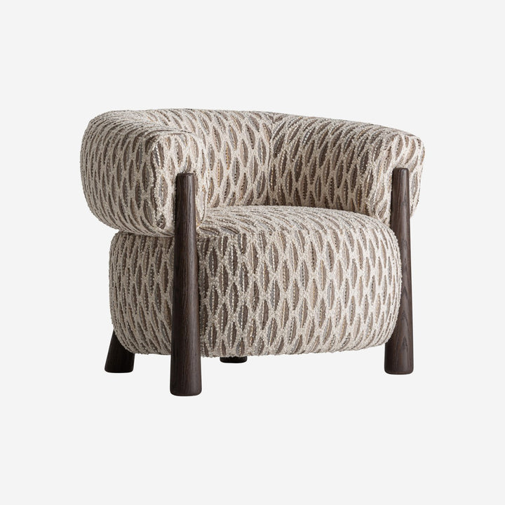 Sillón tapizado en poliéster en tonos neutros