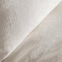 Sofá modular tapizado en lino en color blanco de inspiración art déco – detalle