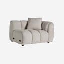 Sofá modular tapizado en poliéster en color gris con módulos acolchados