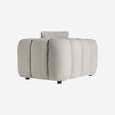 Sofá modular tapizado en poliéster en color gris con módulos acolchados