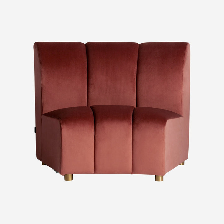 Sofá modular tapizado en terciopelo en color rosa