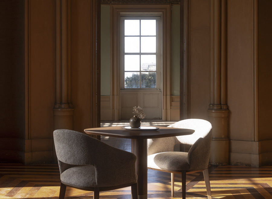 Classic salon with mouldings, carved stone arches and herringbone floor