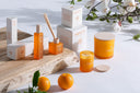 Vela aromática en color naranja (pack de 4) – detalle