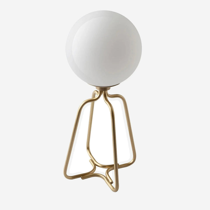 Lámpara de sobremesa acero dorado y cristal blanco, foto de producto sobre fondo gris de estudio
