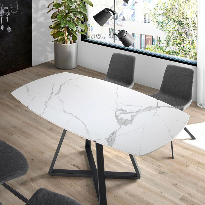 Mesa comedor extensible ovalada barril mármol porcelánico y acero negro