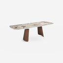 Mesa comedor extensible ovalada barril mármol porcelánico y nogal sobre fondo gris de estudio