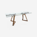 Mesa comedor extensible rectangular cristal templado y nogal sobre fondo gris de estudio