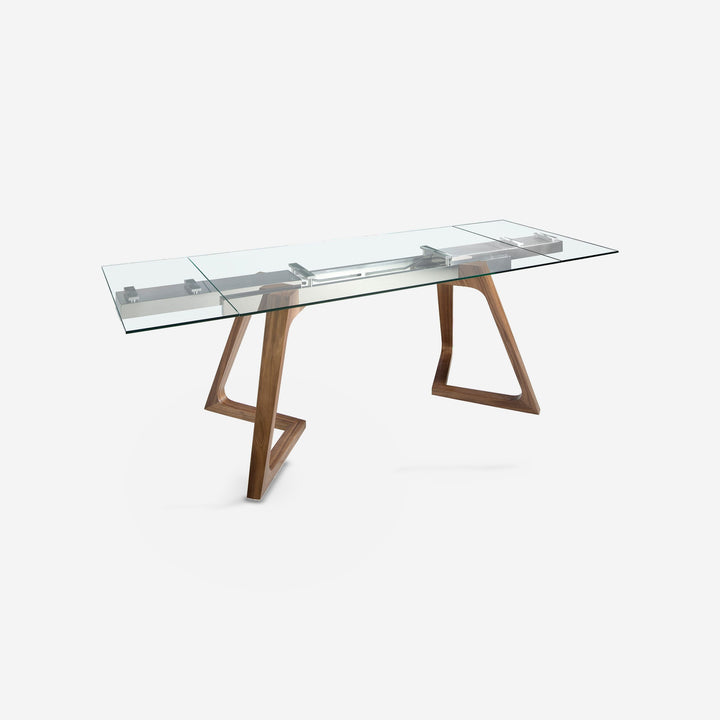 Mesa comedor extensible rectangular cristal templado y nogal sobre fondo gris de estudio