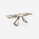 Mesa comedor extensible rectangular mármol porcelánico y acero color champagne sobre fondo gris de estudio