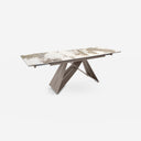Mesa comedor extensible rectangular mármol porcelánico y acero color champagne sobre fondo gris de estudio