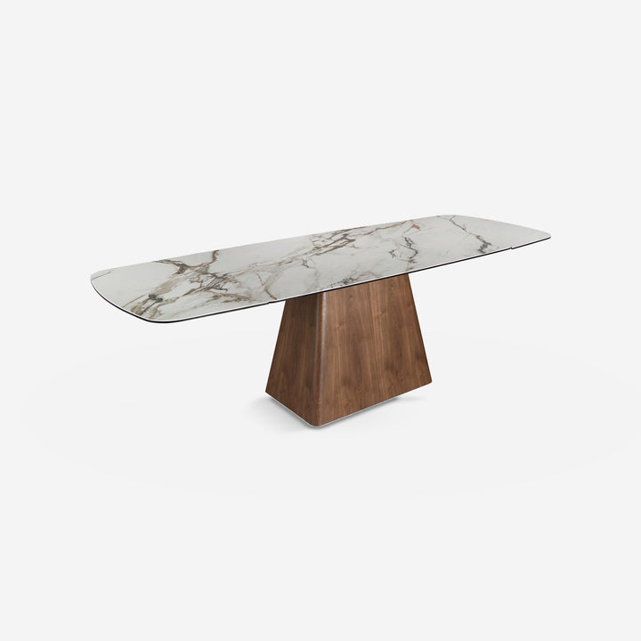 Mesa comedor extensible rectangular mármol porcelánico y nogal sobre fondo gris de estudio