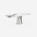 Mesa comedor ovalada barril mármol porcelánico y acero blanco sobre fondo gris de estudio