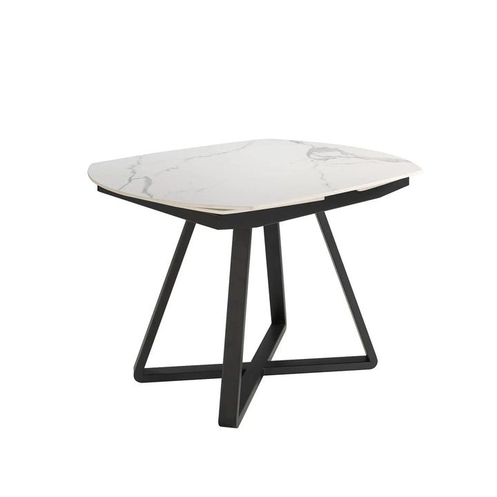 Mesa de comedor ovalada extensible de diseño moderno con patas negras de acero.