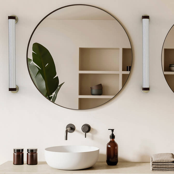 Roseline Wall Lamp 56 - Black base, beige strap and transparent glass shade.