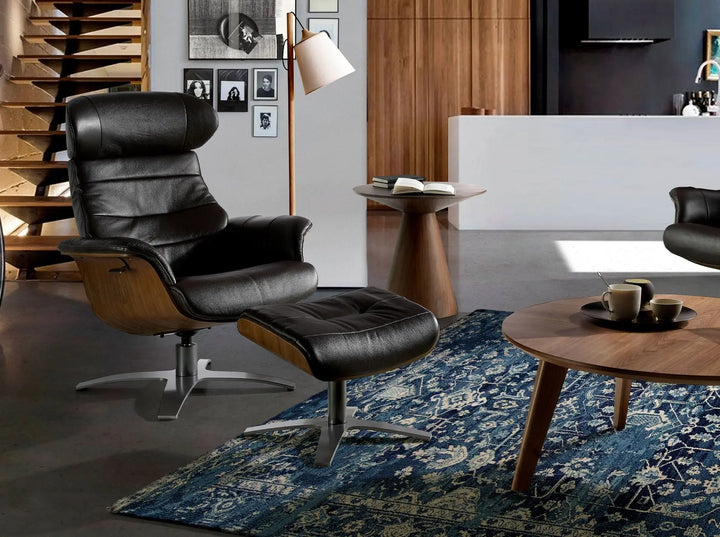 sillón ejecutivo reclinable giratorio en piel negra con apoyacabezas y base en estrella metálica